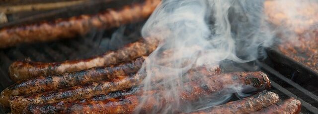 Boerewors sizzling on a braai