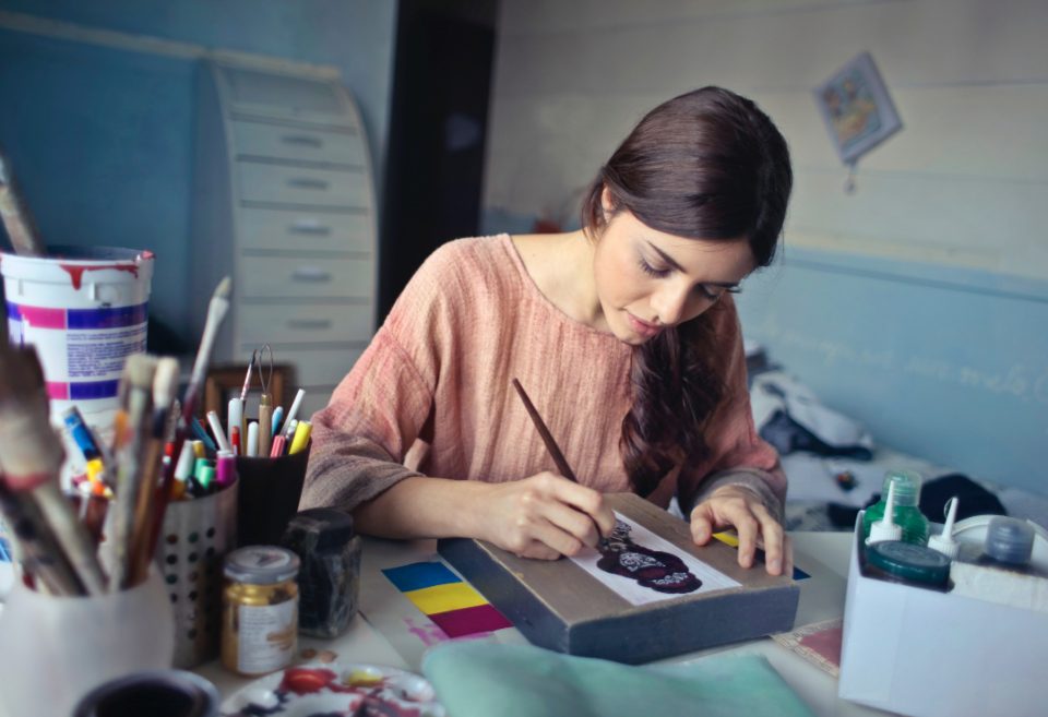 Woman drawing at a desk