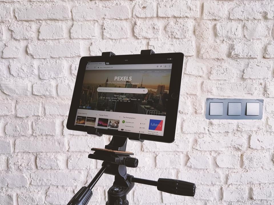 Tablet on a stand showing a website