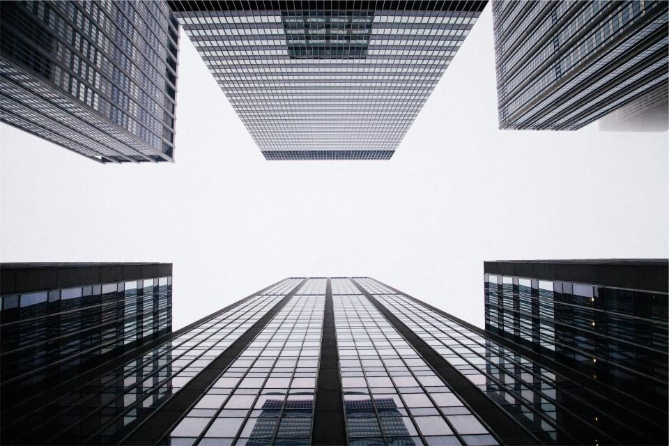 Looking up between tall office towers