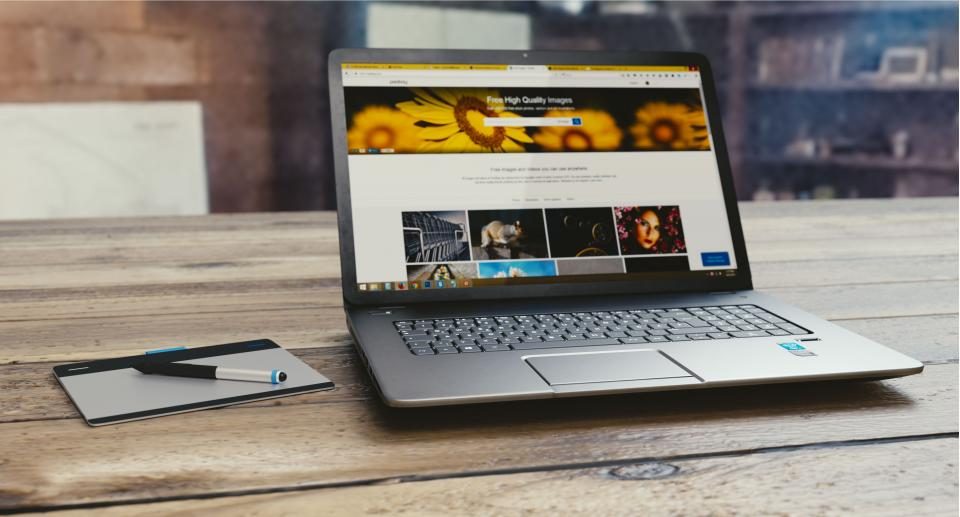 Laptop on a wooden table