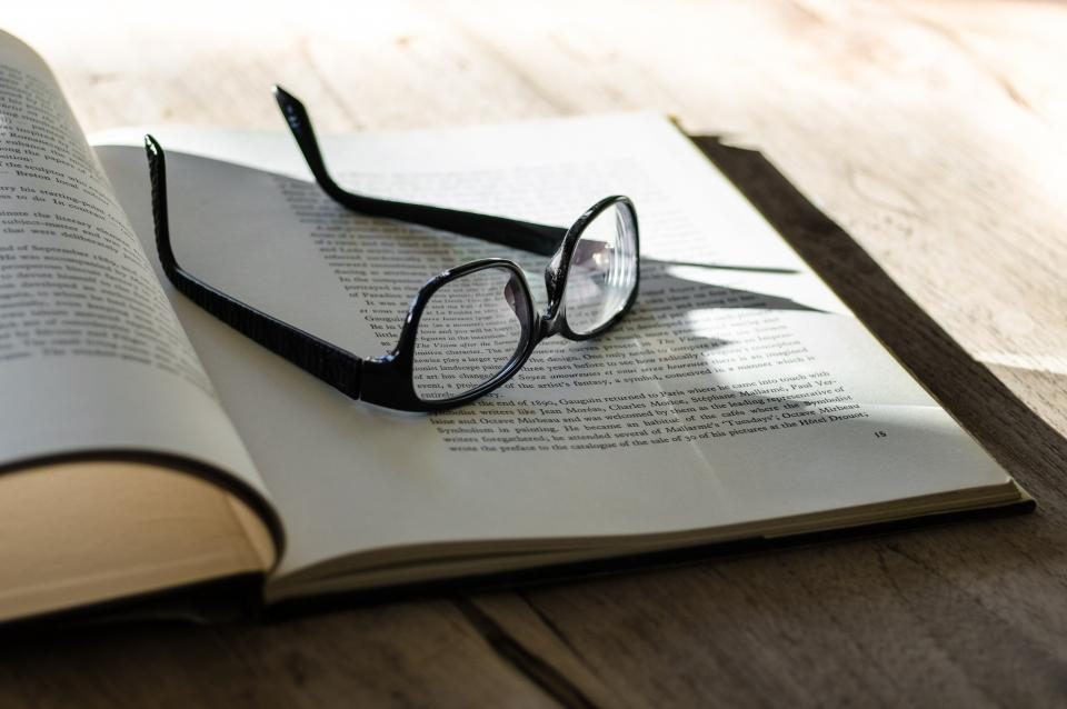 Glasses resting on an open book