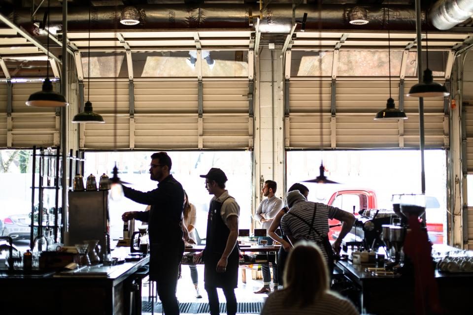 Customers and staff in a busy coffee shop