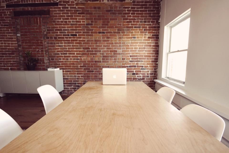 Long meeting table in an empty room