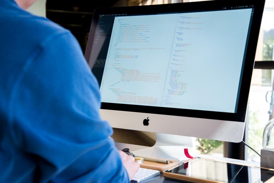 Person working at a desktop computer