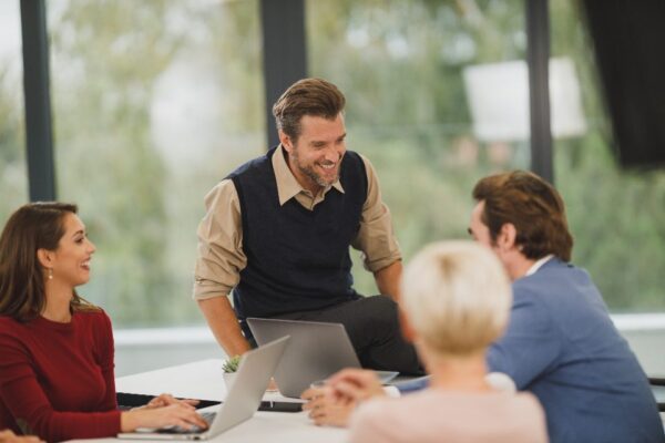 Manager talking with colleagues at a meeting