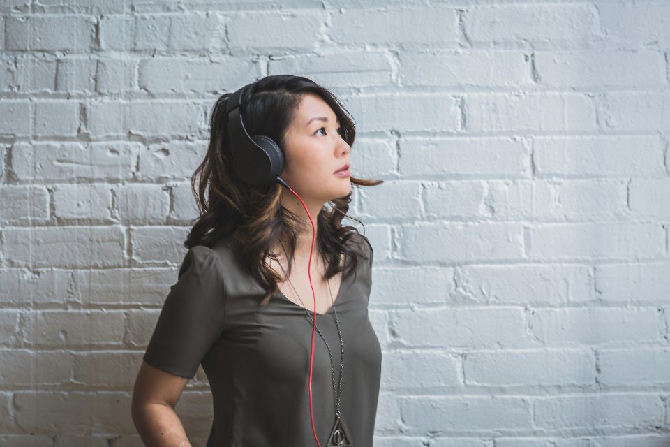 Woman listening on headphones