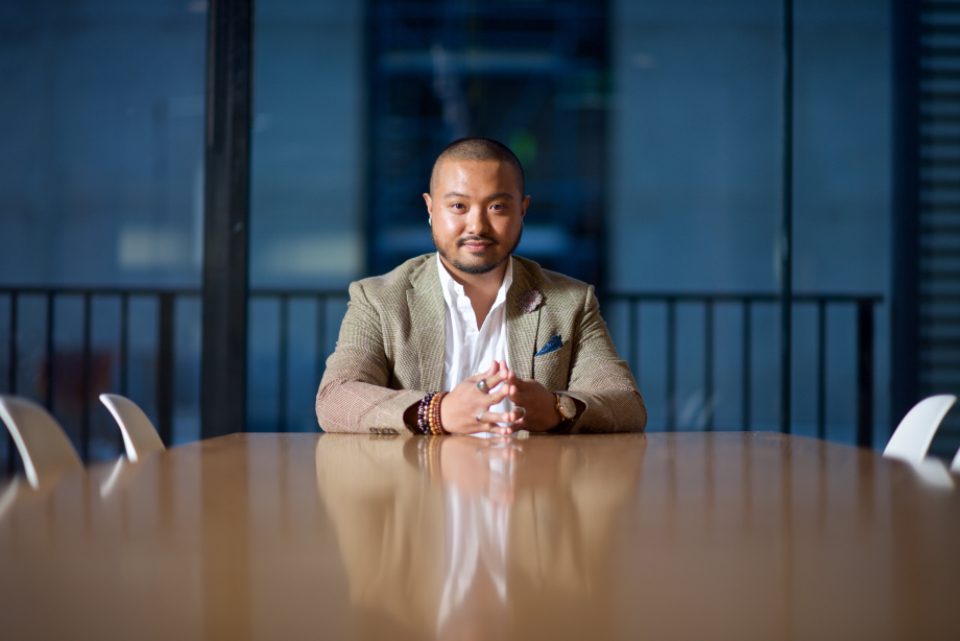 Businessman seated at a boardroom table