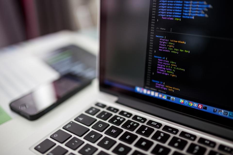 Laptop showing programming code