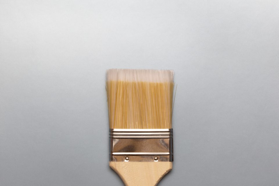 Paintbrush on a grey background
