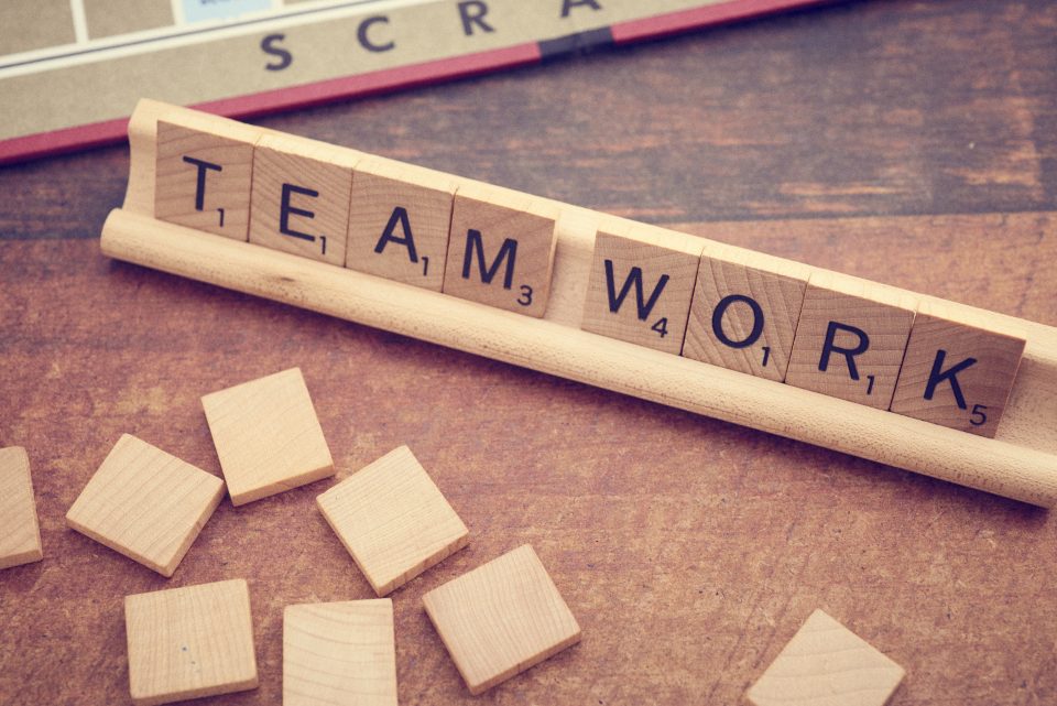 Letter tiles spelling teamwork