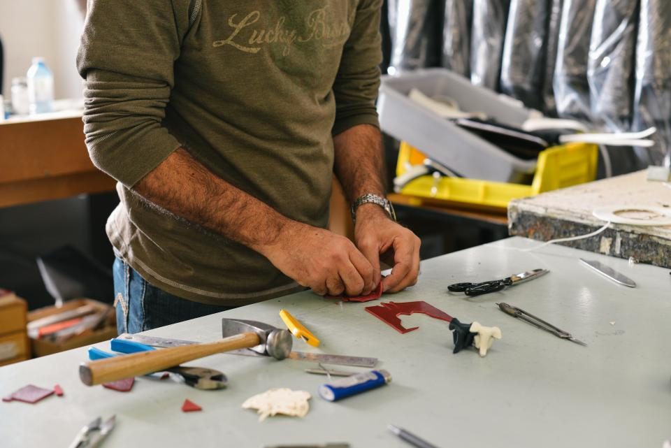 Hands working at a workbench