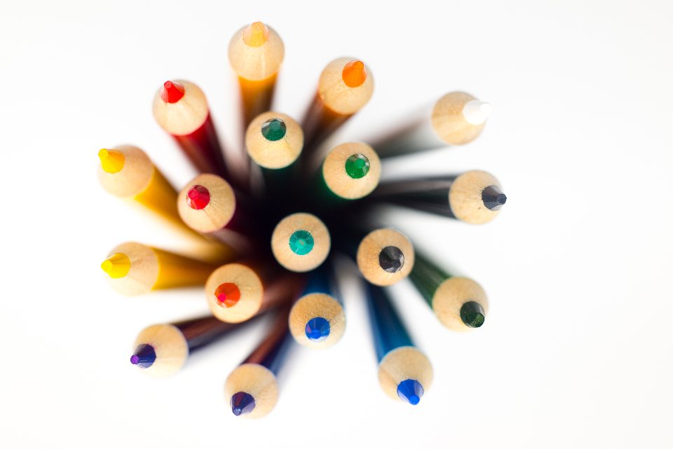 Coloured pencils arranged in a circle