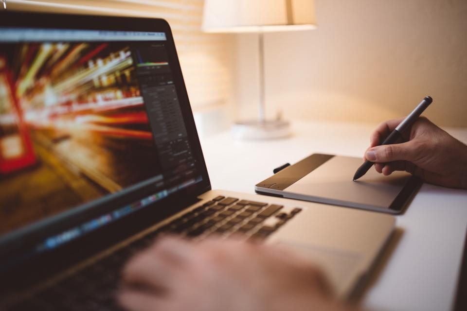 Laptop and drawing tablet in use