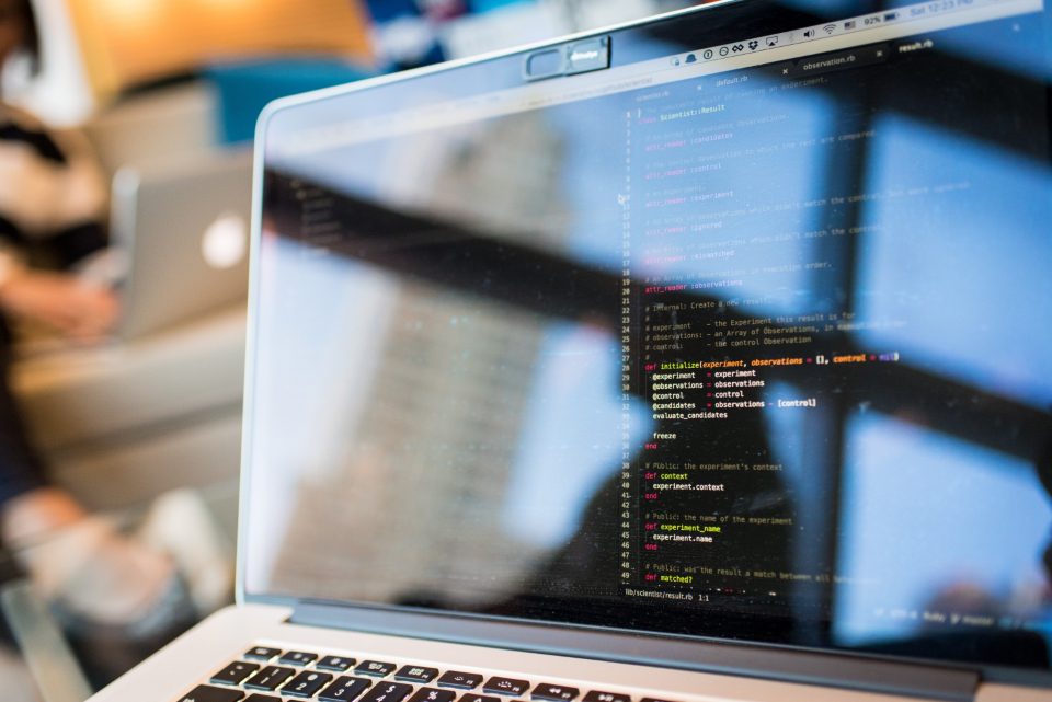 Laptop screen with code in blue light