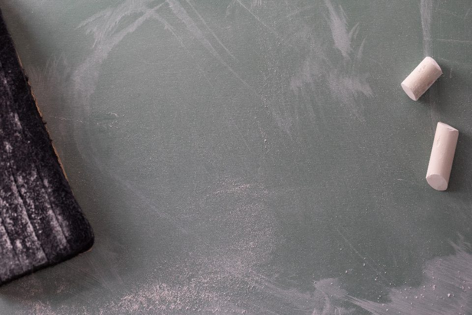 Chalk pieces on a green chalkboard