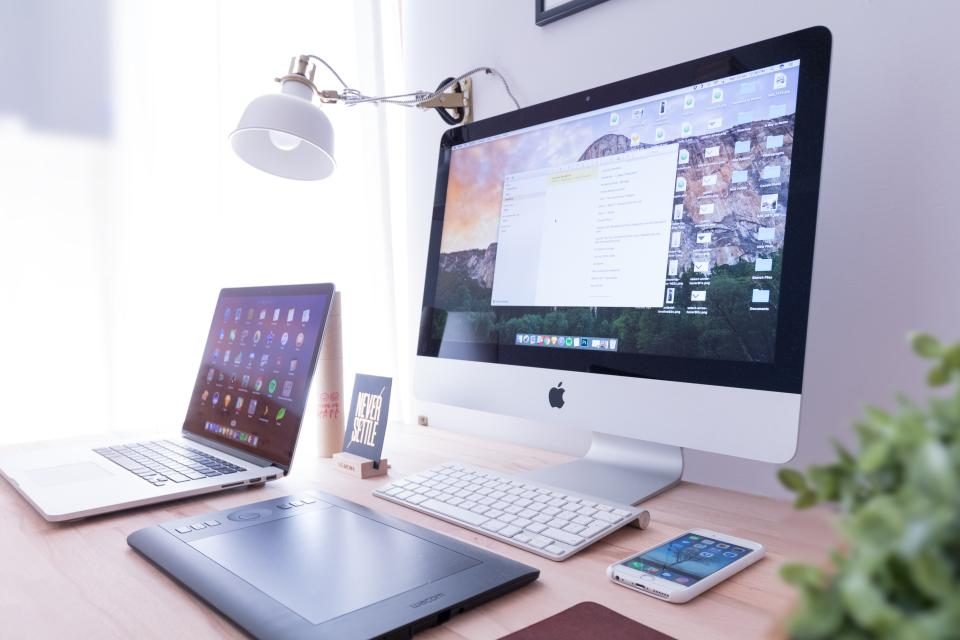 Desktop computer, tablet and phone on a desk
