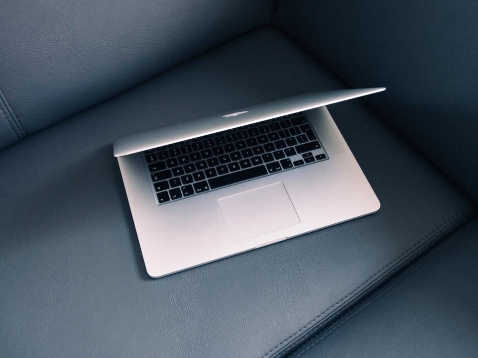 Laptop on a grey seat