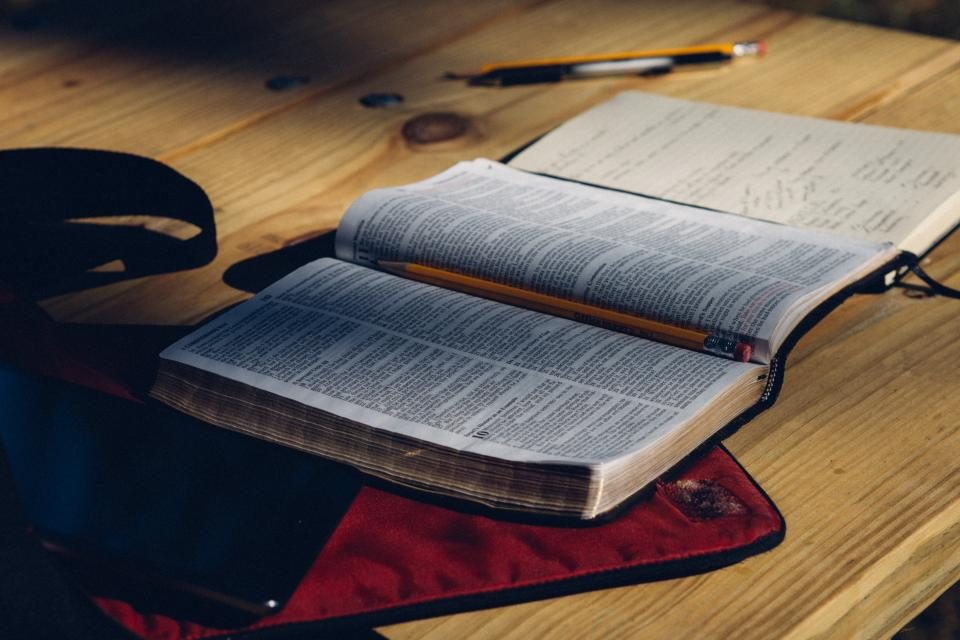 Open book on a wooden desk