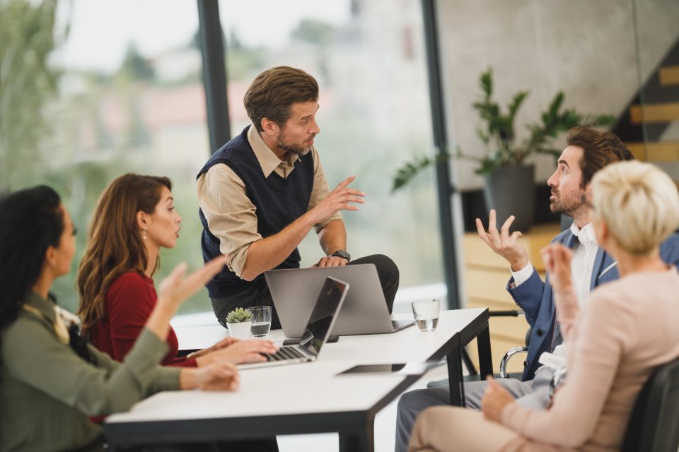 Team discussion around a meeting table