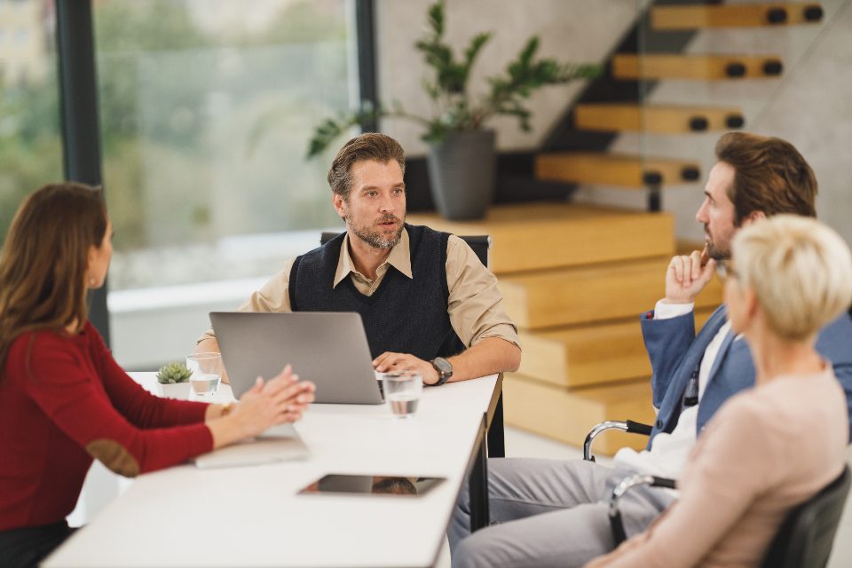 Team in discussion around a meeting table